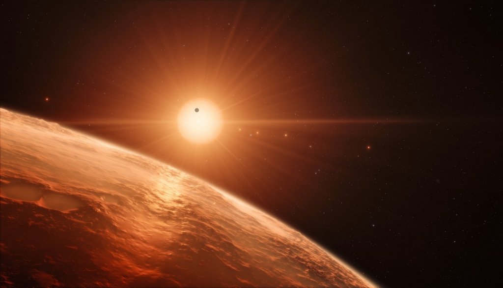 Cette image simule la vue que l'on aurait depuis la surface de l'une des planètes du système Trappist-1 (Photo Nasa)